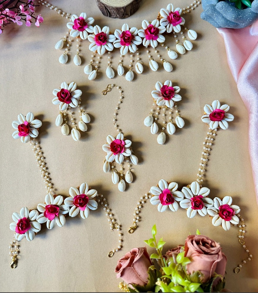 Pink flower with shell jewellery
