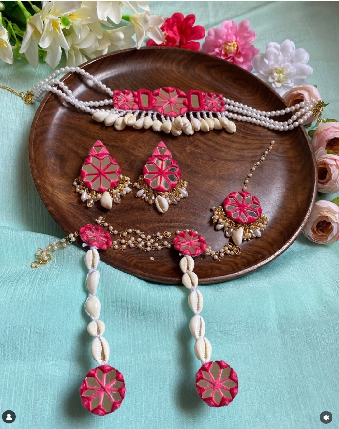 Mirror with shell jewellery